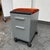 Design Plus Gallery presents a File Cabinet with a Fire Orange Velour Seat Pad. We appreciate the stylized filing cabinet...