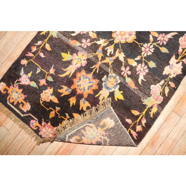 Mid 20th Century Floral tibetan rug on a brown colored ground