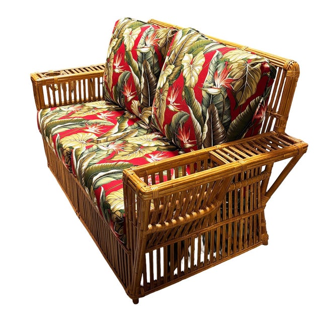 This beautifully restored Nantucket three-seat stick rattan "Nantucket" Sofa featuring wicker wrappings with holders for...