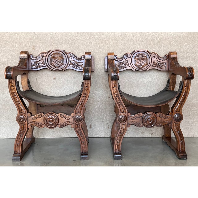 19th century Italian hand carved walnut Savonarola chair, circa 1880. Having wonderfully carved frame with scrolling arms,...