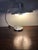 This Space Age table lamp in satin-finish steel has a newly replaced neon circle light. European Plug (up to 250V).The...