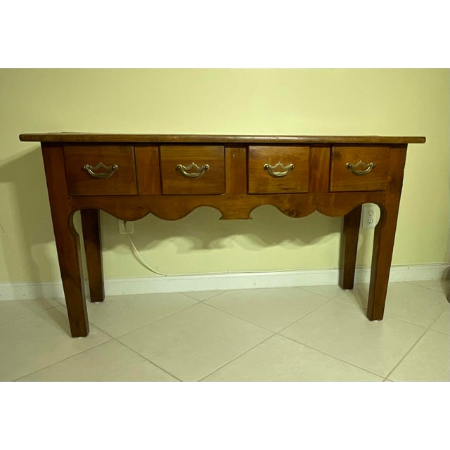 Bring authentic warmth and historic character into your home with this magnificent antique country console table....