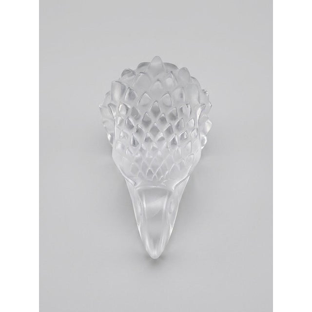 A striking and iconic mid‑century Lalique France crystal eagle head, crafted in heavy lead crystal with Lalique’s...