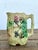 Discover the rustic elegance of this vintage English Majolica pitcher, a stunning example of traditional ceramic artistry....