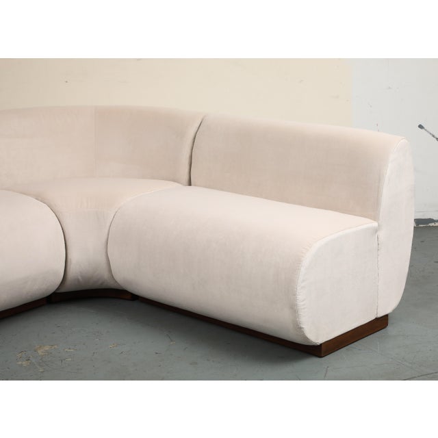 Contemporary 3-piece L-shaped dining banquette with a rounded corner, custom upholstered in ivory performance velvet...