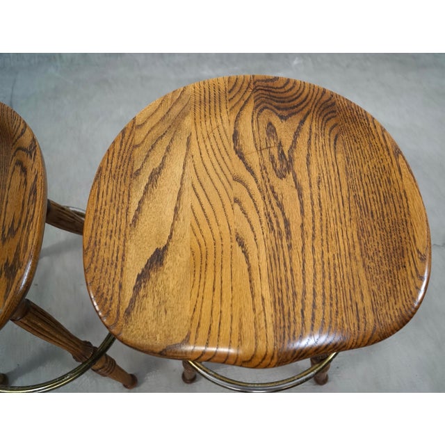Wood 1970’s Solid Oak & Brass Tractor Swivel Counter Stools - A Pair For Sale - Image 7 of 12