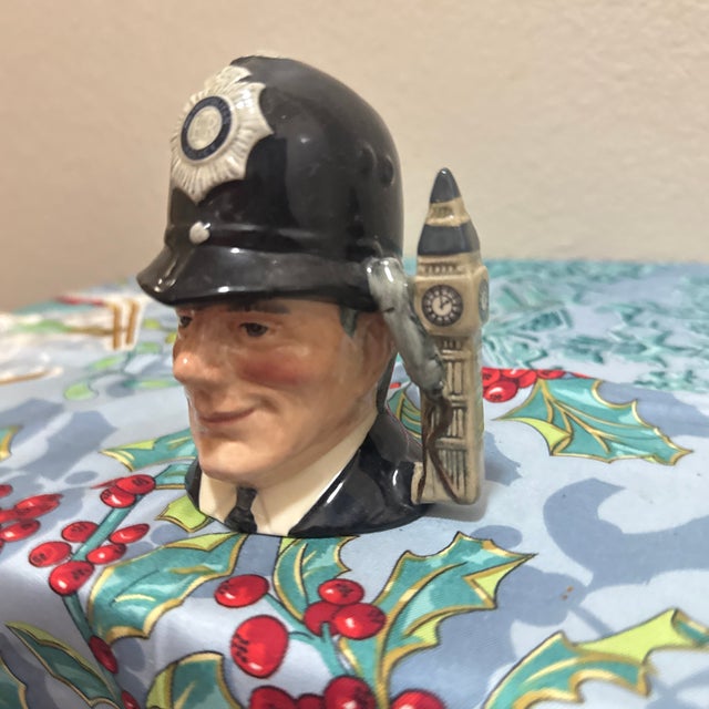 Add a touch of British charm to your collection with this classic Royal Doulton Character Jug, titled "The London Bobby"....
