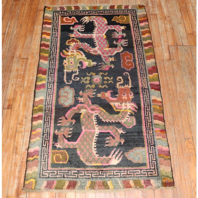 1st Quarter of the 20th-century Tibetan rug with a large-scale dragon motif. The wool is soft, Texture and patina are...