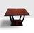 An Art Deco wooden side table featuring a stepped square top, curved supports, and a tiered base. Table can also be used...