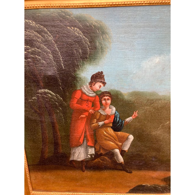 A circa 1900 oil painting of children in a garden setting, a gold leaf frame surrounds the painting and mirror. The piece...