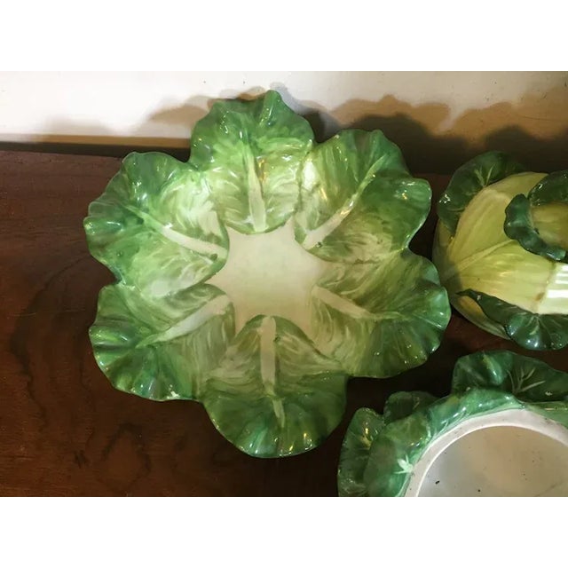 A lovely naturalistically molded Coalport lettuce or cabbage form tureen and cover with under plate. Painted in shades of...