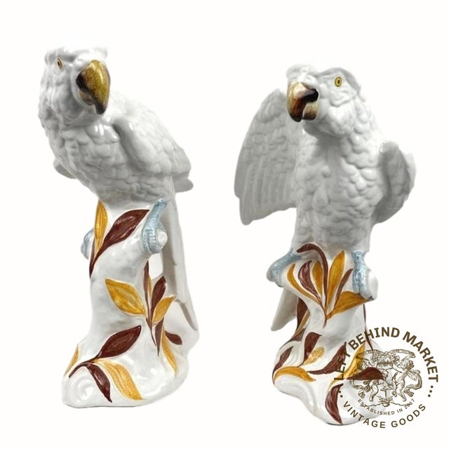 (2 Pc) A pair of large Italian majolica porcelain parrot figurines perched on tree branch bases, painted in white color...