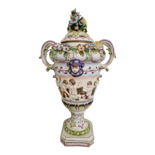 Circa 1900 Vienna-Style Porcelain Potpourri Urn With Applied Flowers, Putti & Blue Shield Mark For Sale