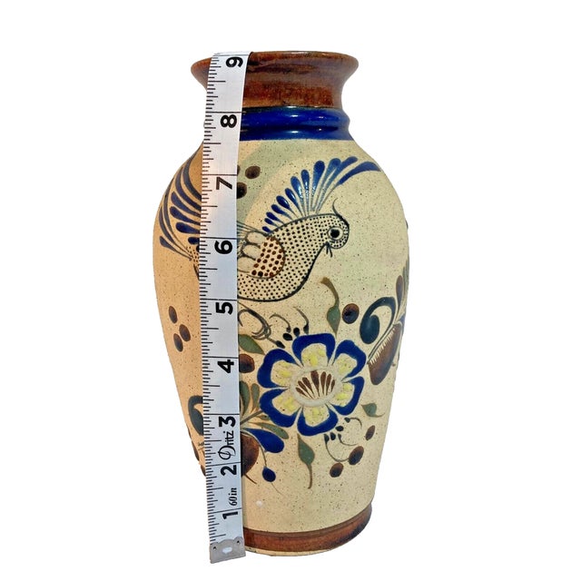 Celebrate the rich tradition of Mexican folk art with this handmade Tonalá pottery vase. Crafted by skilled artisans, this...