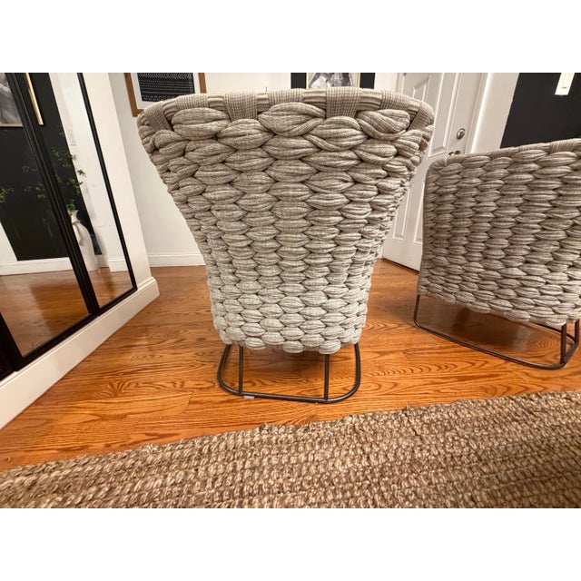 Authentic pair of Paola Lenti designer lounge chairs in a sophisticated gray woven rope finish with upholstered seat...