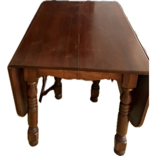 Vintage 1950s solid wood dining set by Abernathy Furniture Company of Leavenworth, Kansas. This well-preserved, American-...