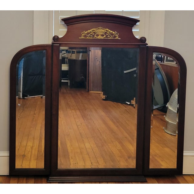From Drexel Heritage's Lineage line, this neoclassical trifold dresser mirror is made of cherry wood with beveled panes of...