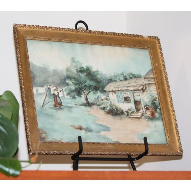 This is a stunning antique watercolor painting of what appears to be an African American woman hanging laundry. The use of...