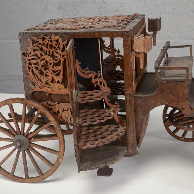 This extraordinary vintage cigarette holder in the shape of a carriage is a fascinating example of finely openwork and...