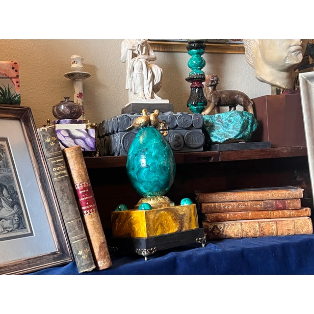 empire style decorative object with faux hand painted malachite egg mounted on an ornate brass stand combined with antique...