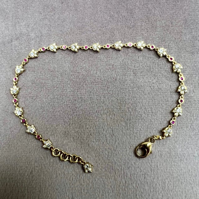 Created in 18 karat yellow gold Rubies 0.20 carat approx. Diamonds 1.35 carats approx. 8 inch length with lobster clasp...