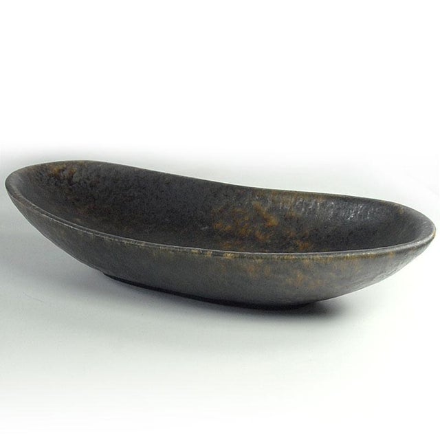 A highly decorative Fat Lava ceramic platter. Glazed. Numerically marked. Manufactured in West Germany by Steuler. Mid-...