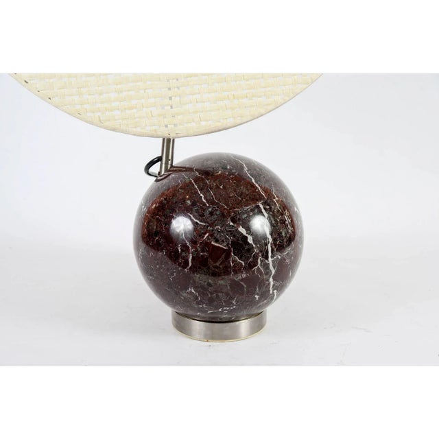 This pair of modernist lamps with a marble bowl and raffia screen shade is in the style of Angelo Brotto. Up to 250V...