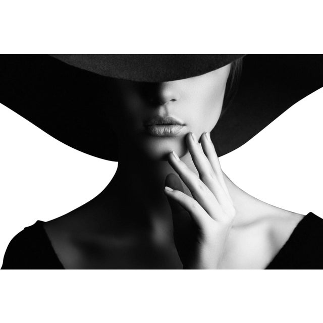 Studio shot of a young beautiful woman on dark background in retro style (Hulton Archive/Getty Images) As an authorized...