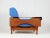 Pair of armchair with teak and skai frame and light blue fabric covering. All cushioned parts such as the backrest, the...