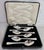 A fine set of six sterling silver dessert or fruit spoons dating to 1938, displaying a refined Art Deco design...