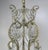 10-light French Louis XV style crystal beaded chandelier, circa 1930s. The chandelier is adorned with etched cut pendulum...