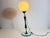 This exquisite table lamp from 1960s Italy is a true mid-century masterpiece, combining clear glass, brass, and opaline...