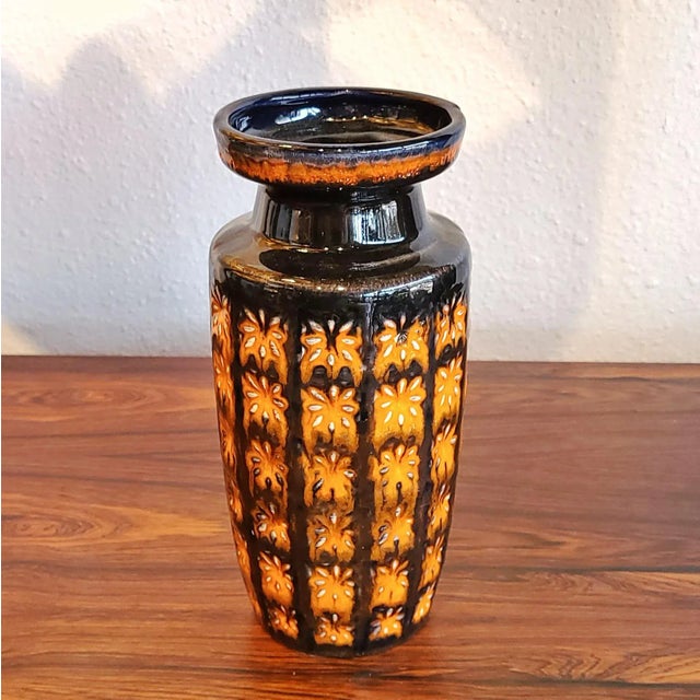 A beautifully shaped SCHEURICH KERAMIK vase with a high-contrast, black-and-orange, relief décor called 'Prisma' from...