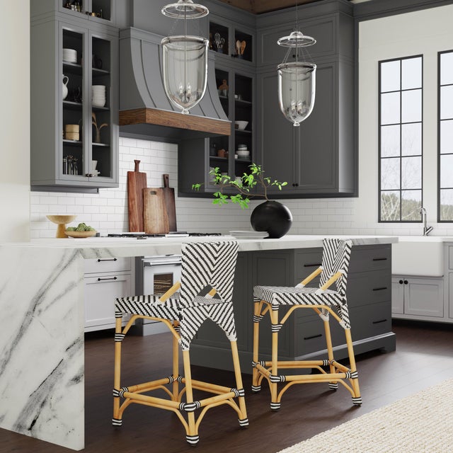 Function, form and fun all come together on this beautiful Butler Specialty Company PU Rattan weave counter stool. The...