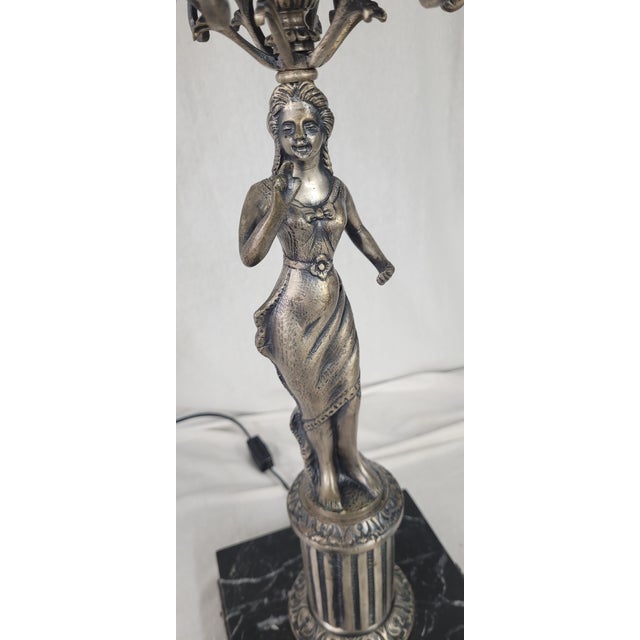 This early 1900s statue lamp is stunning and unique! Made with Spanish brass with a silver coating, this figurine is...