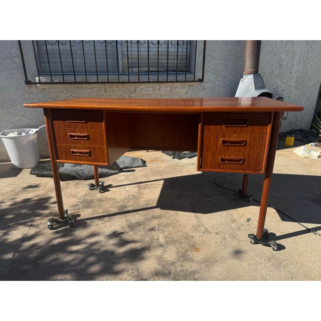 Nice Teak desk made in Denmark. Beautiful addition to your office. Top has been re finished. Desk is finished on all sides...