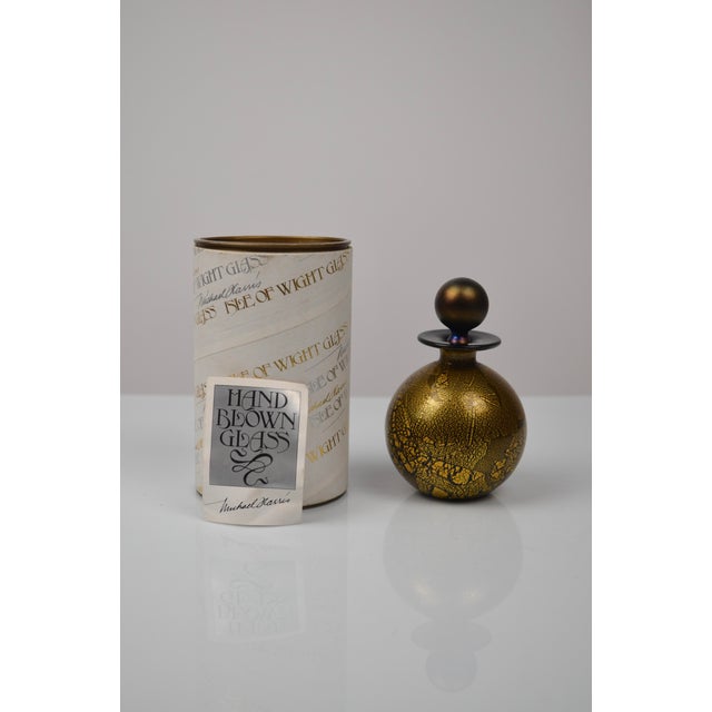 Elegant vintage perfume bottle by Isle of Wight Studio Glass, illustrating the studio’s renowned expertise in gold-leaf...