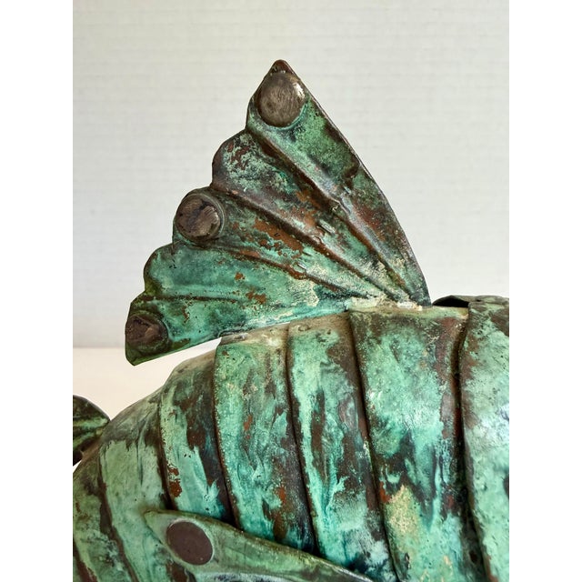 Here is a fantastic vintage, handmade, original articulated metal fish sculpture, likely made in Peru in the mid-20th...
