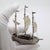 An impressive vintage Italian sculpture depicting a galleon sailing ship, handcrafted in Arezzo, Tuscany in 1991 in...