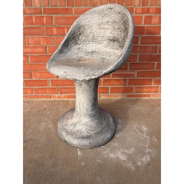 An exceptional sculptural concrete garden chair in the manner of Swiss designer Willy Guhl, dating to the 1960s. This...