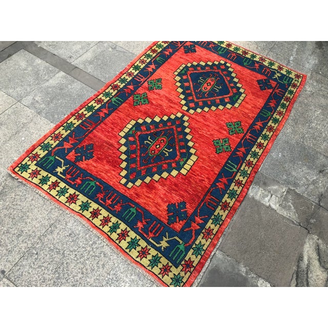 This is a vintage Turkish Oushak rug from the 1960s. The piece was hand-knotted.