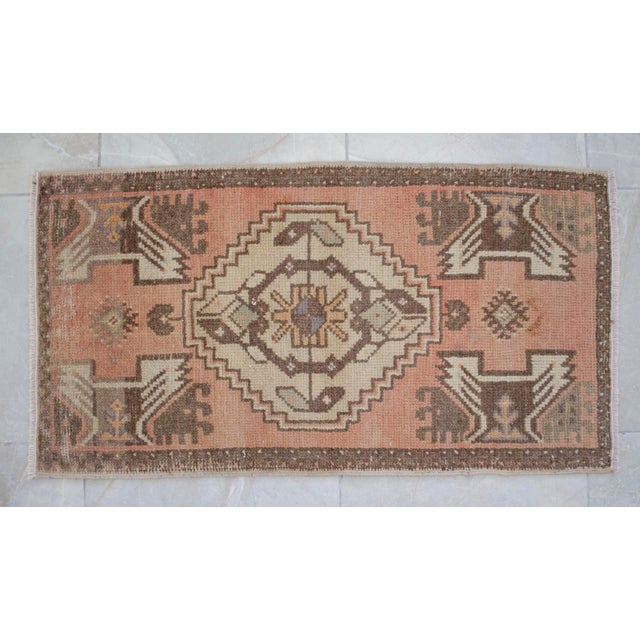 A vintage Turkish small yastik rug, brandy punch ( strong red-orange) background color yastik rug perfect for entryway,...