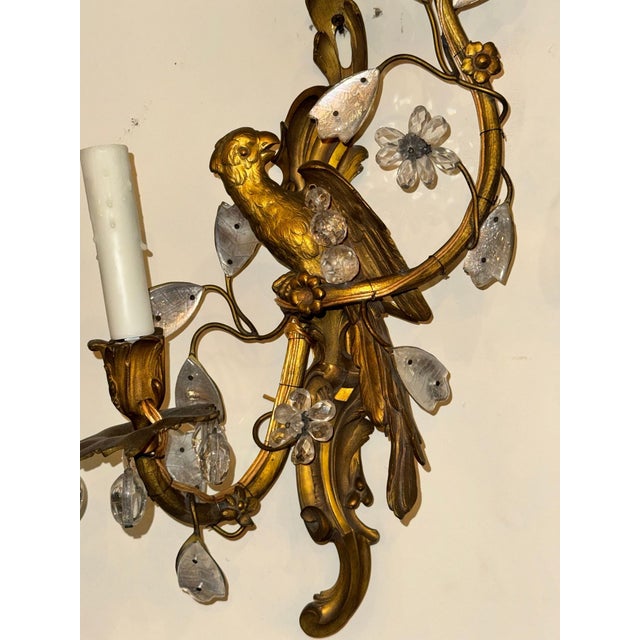 Exceptional pair of French Bagues style bronze wall sconces. Featuring sculpted birds perched on scrolling branches....