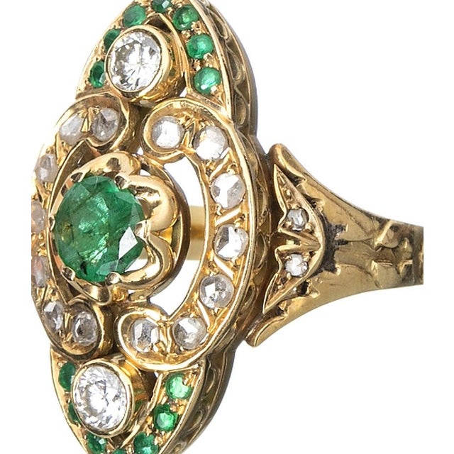 19.2K Gold Ring with Emeralds. Portuguese; in 19.2kt gold; set with brilliant-cut and pink diamonds; with an estimated...