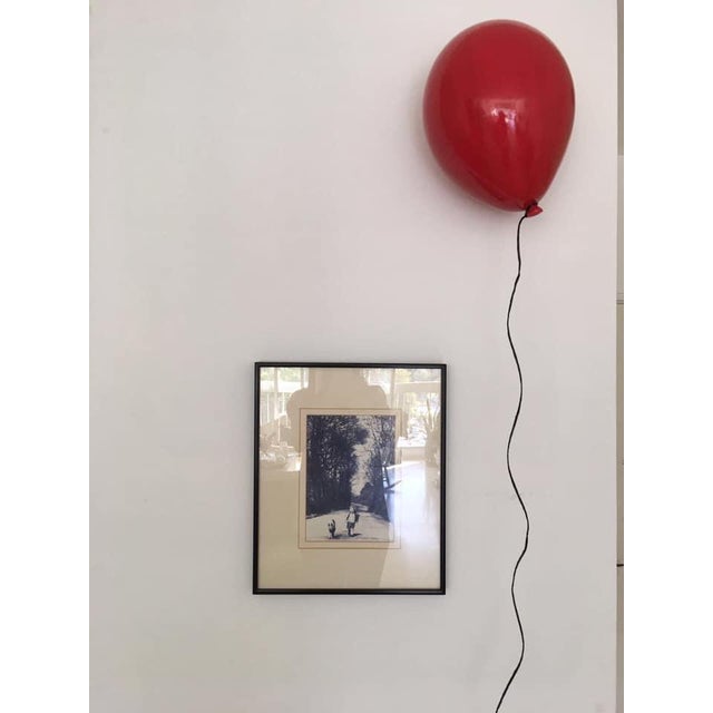 Add a unique sense of individuality into your space with this incredibly stylish red balloon wall sculpture. Handcrafted...
