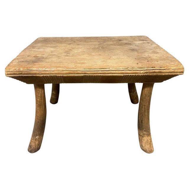 Antique hand made side table or stool with a three inch thick bevelled top featuring an interesting yet simple carving....