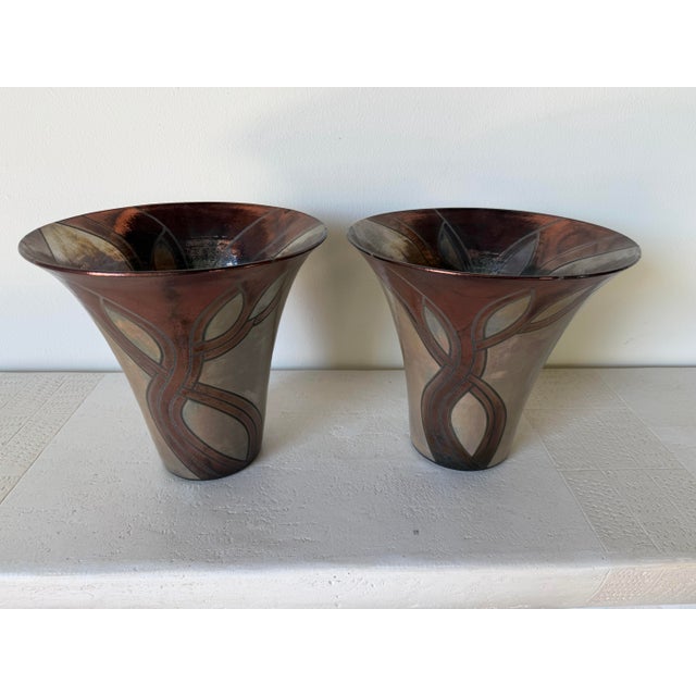 Beautiful pair of vintage handcrafted Raku pottery vases featuring a dramatic flared silhouette with organic abstract...