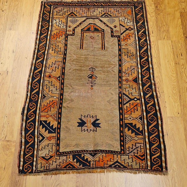 "This vintage Kurdish tribal area rug features a classic prayer rug composition woven in the early 20th century in...
