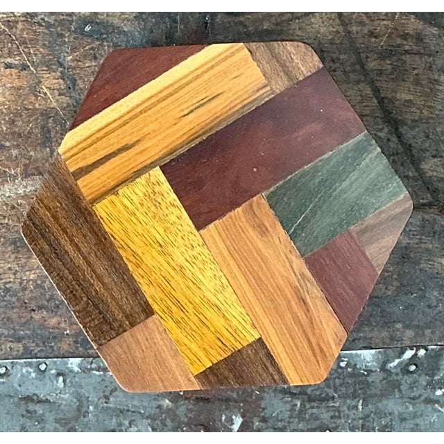 This exquisite vintage wooden box is a masterclass in geometric parquetry, featuring a meticulously hand-assembled mosaic...