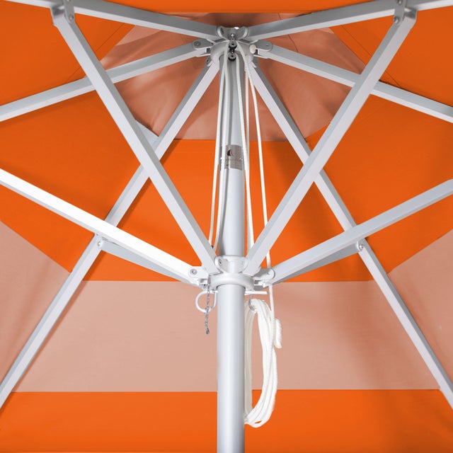 The Tuscan Sunset Market Umbrella is a 9' Hexagon in solid aluminum powder coated silver. The canopy features a block...